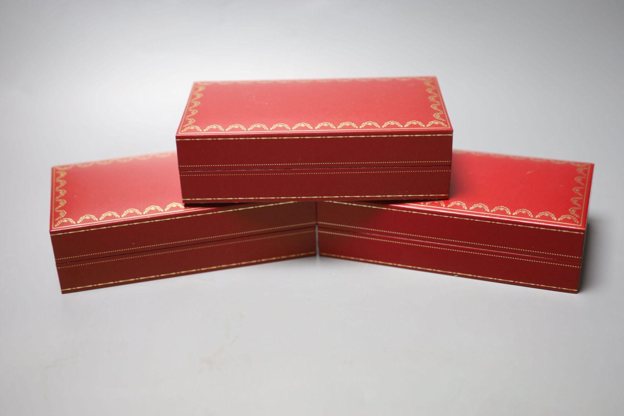 Three modern Cartier fitted jewellery boxes and one other Cartier box.